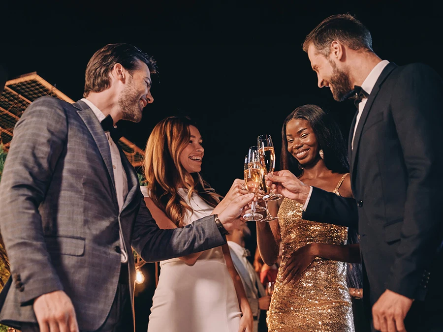 Friends celebrating an elegant evening at a luxury event in The Palm Beaches.