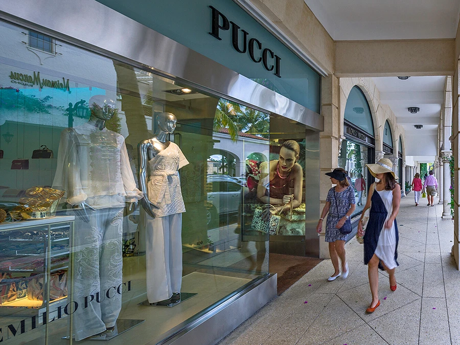 Visitors enjoying luxury shopping along Worth Avenue in The Palm Beaches.